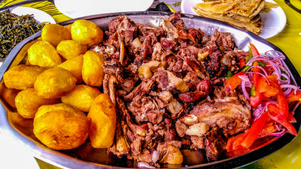 Nyama choma, Swahili for roast meat, is slow cooked in outdoor kitchen and eaten with the hands.  This order was 1 kilo of the most popular, mbuzi choma or roasted goat.